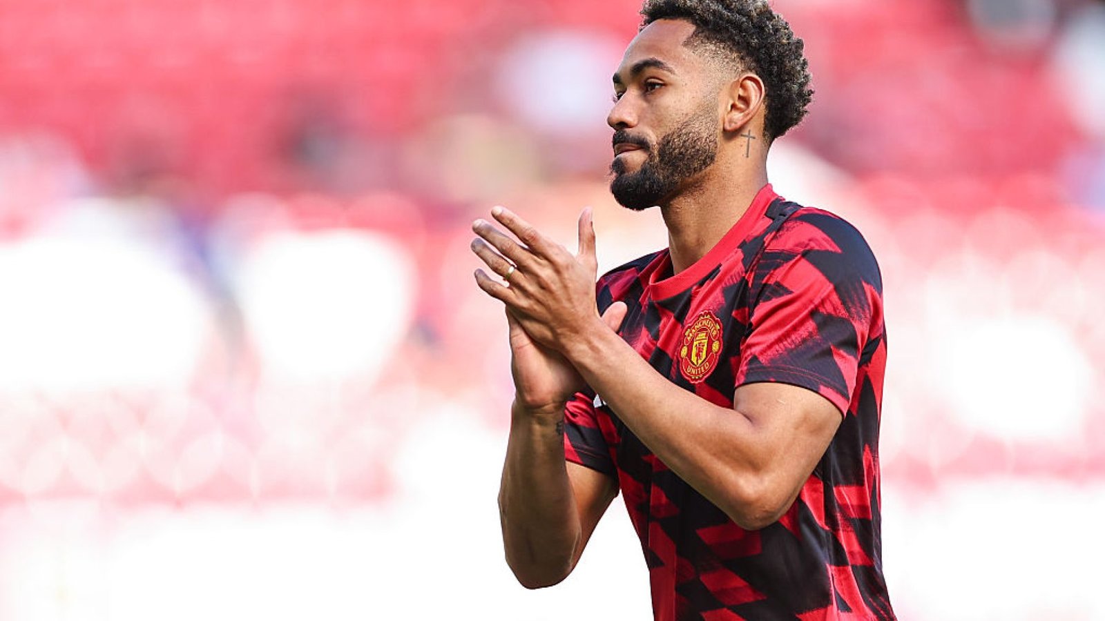 MANCHESTER, ENGLAND - AUGUST 17: Matheus Cunha of Manchester United warms up ahead of the Premier...